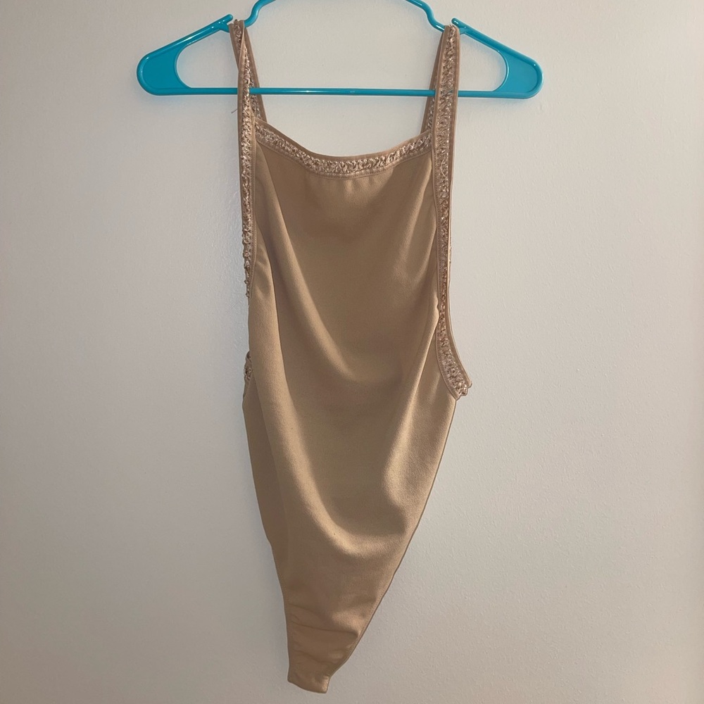 Tan body suit